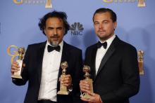 González Iñárritu y Leonardo Di Caprio celebran el triunfo.